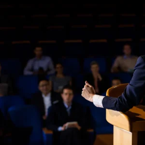 rear view female business executive giving speech